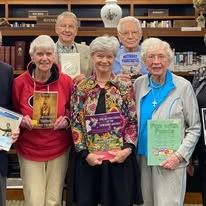 Ascension Living Alexian Village Tennessee Senior Living, independent living, assisted living, memory care, and continuing care retirement community (CCRC) in Signal Mountain, TN, residents smiling while holding books