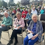 Addolorata Villa, continuing care retirement community offering independent living, assisted living, and memory care in Wheeling, IL, residents enjoying an outdoor celebration