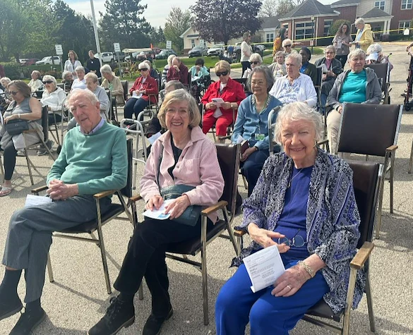 Addolorata Villa, continuing care retirement community offering independent living, assisted living, and memory care in Wheeling, IL, residents enjoying an outdoor celebration