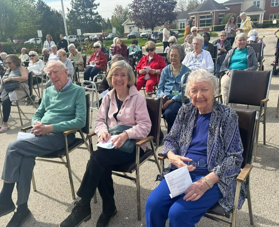 Addolorata Villa, continuing care retirement community offering independent living, assisted living, and memory care in Wheeling, IL, residents enjoying an outdoor celebration