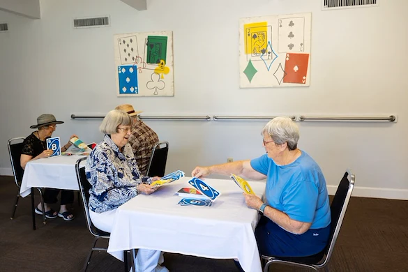 Friends playing cards at Fellowship Square Tucson