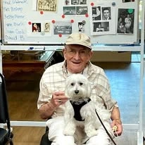 Stoneybrook Lodge Gracious Retirement Living Hawthorn Senior Independent Living in Corvallis, Oregon resident holding a dog