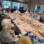 Gaines Park residents enjoying a Mother's Day tea party