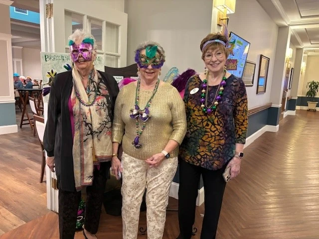 Covenant Living at Inverness in Tulsa, OK, smiling residents having fun during a celebration