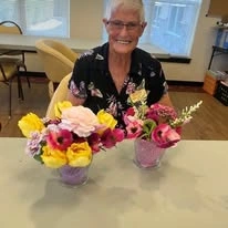 Estrella Estates Gracious Retirement Living Hawthorn Senior Independent Living in Goodyear, Arizona resident with DIY bouquet