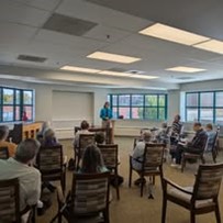 Ascension Living Bethlehem Woods Village Senior Living in La Grange Park, Illinois residents listening to a speaker