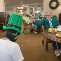 Colonial Gardens Gracious Retirement Living Hawthorn Senior Independent Living in Beverly, Massachusetts residents at a St. Patrick's Day party