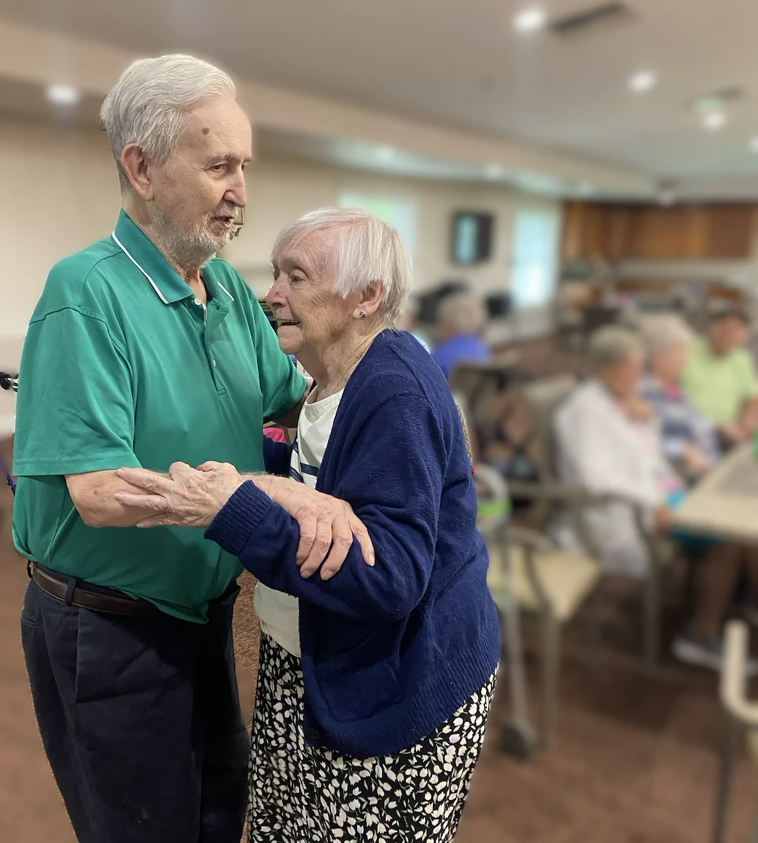 Long House senior living community offering independent living and respite care in Erlanger, KY, residents having fun dancing