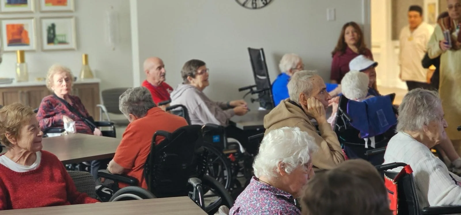 Addolorata Villa, continuing care retirement community offering independent living, assisted living, and memory care in Wheeling, IL, residents engaged in a presentation