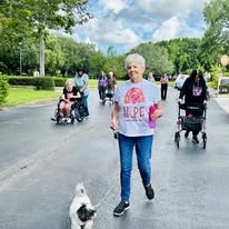 Sonata Coconut Creek seniors going for an outdoor walk together