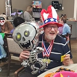 American House Westland Venoy senior living community offering independent living, assisted living, and respite care in Westland, MI, resident dressed up for a community Halloween celebration
