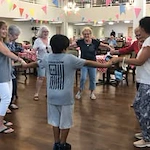 Colonial Harbor Gracious Retirement Living Hawthorn Senior Independent Living in Yorktown, Virginia residents playing a game with kids in the community