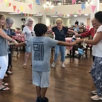 Colonial Harbor Gracious Retirement Living Hawthorn Senior Independent Living in Yorktown, Virginia residents playing a game with kids in the community