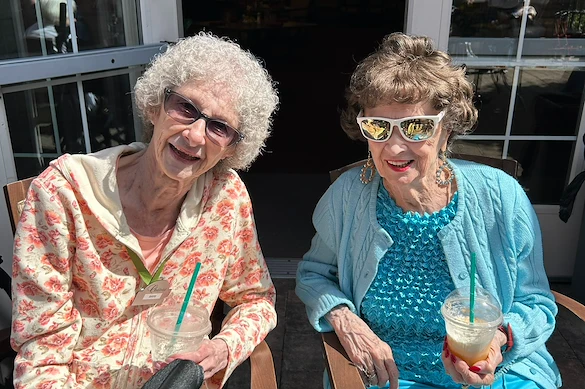 Chateau Bothell Landing in Bothell, WA, smiling residents enjoying sunshine