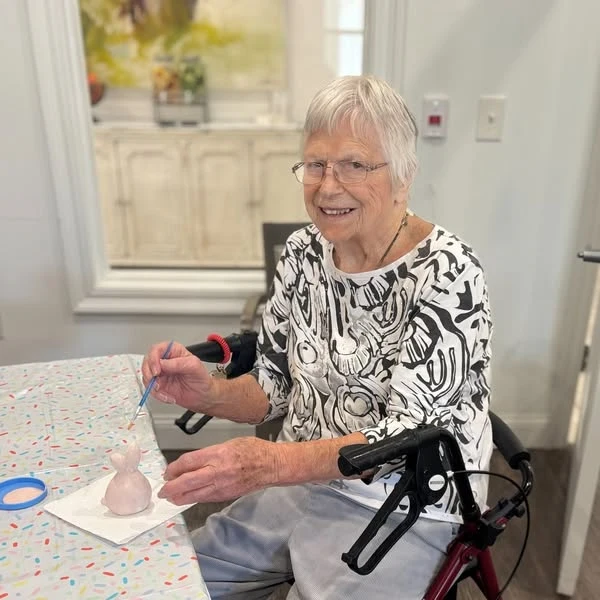 The Blake at Kingsport residents painting pottery bunnies