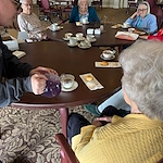 American House Elmwood, senior living community offering independent living, assisted living, memory care, and respite care in Rochester Hills, MI, residents enjoying each other's company and coffee together