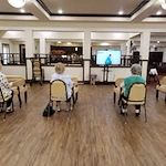 Maple Ridge Gracious Retirement Living Hawthorn Senior Independent Living in Cedar Park, Texas residents doing a workout video class