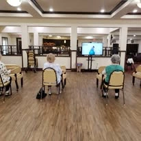 Maple Ridge Gracious Retirement Living Hawthorn Senior Independent Living in Cedar Park, Texas residents doing a workout video class