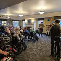 Oak Park Senior Living by Cogir in Roseburg, Oregon residents watching musical entertainment