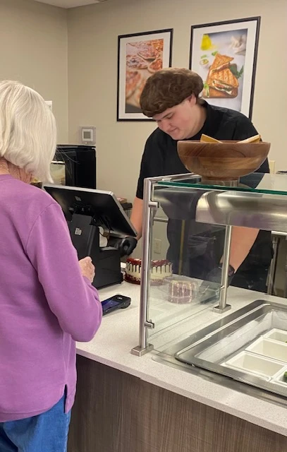 Buying a treat at the bistro