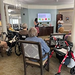 Charter Senior Living of Franklin in Franklin, Tennessee, residents learning through a presentation