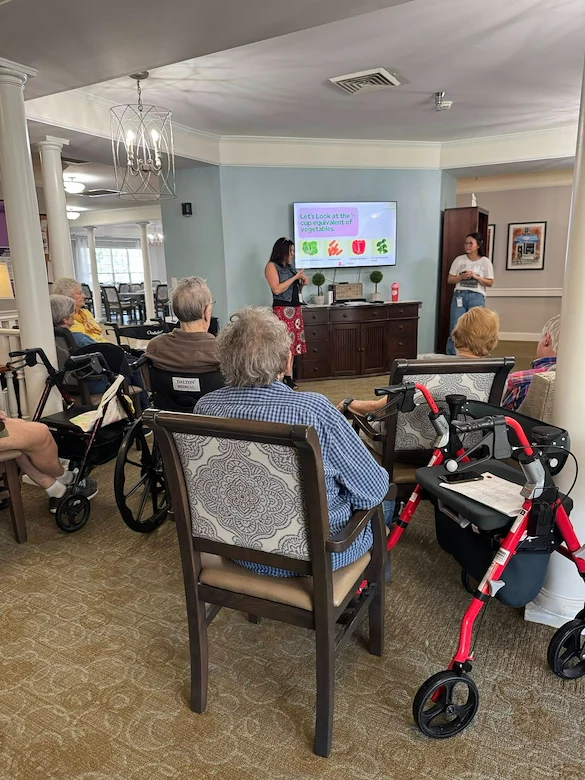 Charter Senior Living of Franklin in Franklin, Tennessee, residents learning through a presentation