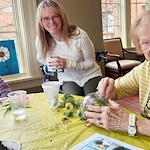 Mallard Cove Senior Living in Cincinnati, OH, resident engagement activity - planting flowers