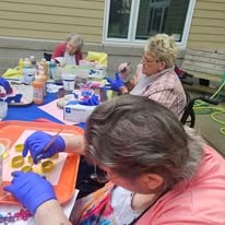 Ascension Living Lakeshore at Siena Memory Care Senior Living in Racine, Wisconsin residents painting outside