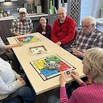 CopperWood at Prairie Trail senior living community offering assisted living and memory care in Ankeny, IA, residents playing a game together