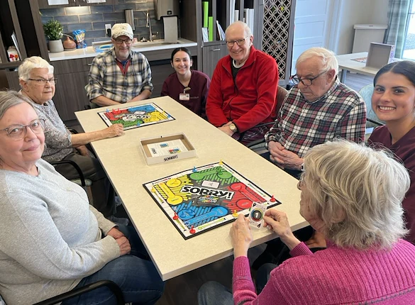 CopperWood at Prairie Trail senior living community offering assisted living and memory care in Ankeny, IA, residents playing a game together