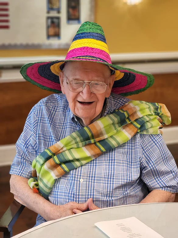 Montclair Park Assisted and Independent Senior Living in Shreveport, LA resident wearing a colorful hat and scarf