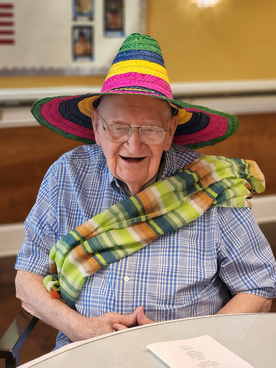Montclair Park Assisted and Independent Senior Living in Shreveport, LA resident wearing a colorful hat and scarf