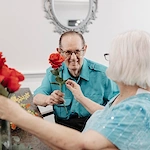 Seniors sharing roses