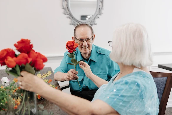 Seniors sharing roses