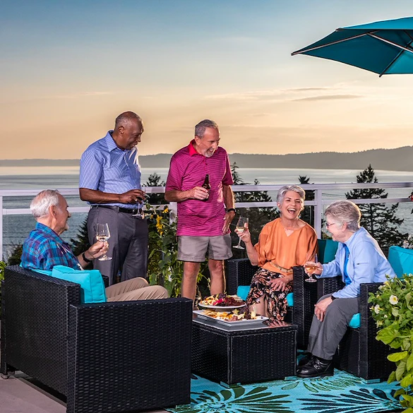 Judson Park Senior Living in Des Moines, WA, residents having fun socializing during a happy hour outside