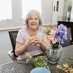 Senior participating in floral activity