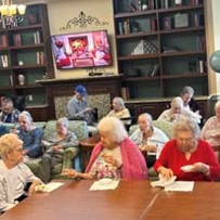 seniors eating treats at a party