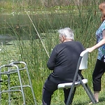 Porter Place Assisted Senior Living Memory Care in Tinley Park, IL resident fishing in a pond