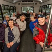 Carolina Estates Gracious Retirement Living Hawthorn Senior Independent Living in Greensboro, North Carolina residents on a transportation bus