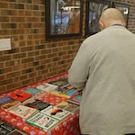 Avina of Milwaukee Senior Living assisted living and independent living in Milwaukee, WI, resident at a library book fair