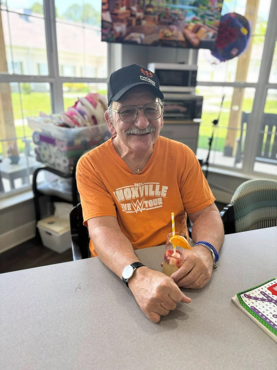 Charter Senior Living of Cleveland smiling resident during happy hour