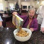 Ivy Creek Gracious Retirement Living Hawthorn Senior independent Living in Glen Mills, Pennsylvania resident pouring a large bowl of cereal