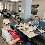 Residents of Regency House celebrate Mardi Gras with some drinks and snacks