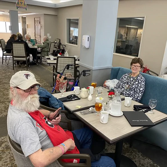 Residents of Regency House celebrate Mardi Gras with some drinks and snacks