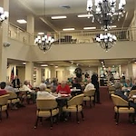 Linwood Estates Gracious Retirement Living Hawthorn Senior Independent Living in Lawrenceville, Georgia residents gathered in the dining room
