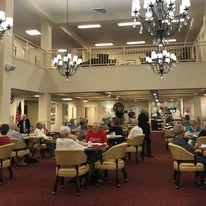 Linwood Estates Gracious Retirement Living Hawthorn Senior Independent Living in Lawrenceville, Georgia residents gathered in the dining room