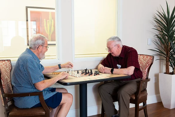 Residents playing chess at Fellowship Square Surprise