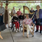 Ascension Casa Scalabrini Senior Living, independent senior living community in Northlake, IL, residents smiling while enjoying time together outside