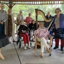 Ascension Casa Scalabrini Senior Living, independent senior living community in Northlake, IL, residents smiling while enjoying time together outside