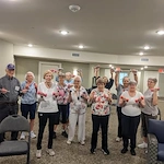 Wilshire Senior Living, independent living, assisted living, and memory care in Burleson, TX, residents staying active by lifting weights